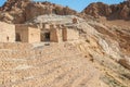 Ruined stone houses of an ancient settlement in the desert Royalty Free Stock Photo