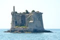 A ruined tower on a rocky island Royalty Free Stock Photo