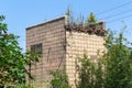 Ruined wall of building. Abandoned to unnecessary houses are destroyed. Self-destruction of abandoned buildings. Conceptually, cri Royalty Free Stock Photo