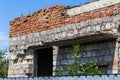 Ruined wall of building. Abandoned to unnecessary houses are destroyed. Self-destruction of abandoned buildings. Conceptually, cri Royalty Free Stock Photo