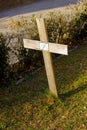The wooden cross on the tombstone.