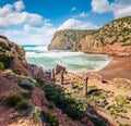 Ruines of old village. Sunny morning view of Cala Domestica beach. Bright summer scene of Sardinia, Italy, Europe. Splendid landsc