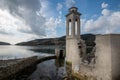 Ruins of an abandoned and deserted church in the water of a dam.