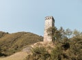 Ruins of an abandoned watch tower of Svaneti stand on a hill in Georgia