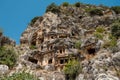 The ruins of the amphitheater and ancient rock tombs in the ancient city of Myra in Demre, Turkey Royalty Free Stock Photo