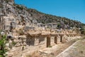 The ruins of the amphitheater and ancient rock tombs in the ancient city of Myra in Demre, Turkey Royalty Free Stock Photo