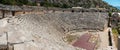 The ruins of the amphitheater and ancient rock tombs in the ancient city of Myra in Demre, Turkey Royalty Free Stock Photo