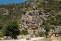 The ruins of the amphitheater and ancient rock tombs in the ancient city of Myra in Demre, Turkey Royalty Free Stock Photo