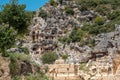 The ruins of the amphitheater and ancient rock tombs in the ancient city of Myra in Demre, Turkey Royalty Free Stock Photo