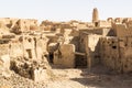 Ruins of ancient middle eastern old town built of mud bricks, old mosque, minaret. Al Qasr, Dakhla Oasis, Western Desert, Egypt.