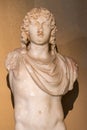 Ancient statue of armless young boy Royalty Free Stock Photo