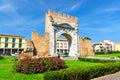 Ruins of ancient brick wall and stone gate Arch of Augustus Arco di Augusto in Rimini Royalty Free Stock Photo