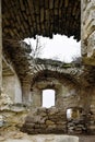 Ruins of an ancient Christian temple. Collapsed ceiling. Masonry, rooms with arched vaults. Tree grow on the wall. Moldova