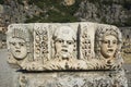 Ruins of ancient city of Myra in Demre, Turkey. Theatrical mask relief of ancient town of Myra Royalty Free Stock Photo