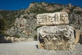 Ruins of ancient city of Myra in Demre, Turkey. Theatrical masks relief and ancient rock tombs Royalty Free Stock Photo