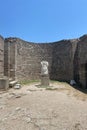 Ruins ancient city stone temple in izmir, top arches, keystones, columns, torso statue, high stone wall
