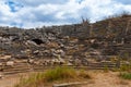 Ruins of ancient Greek amphitheater In Fethiye, Turkey. Ancient columns and walls destroyed by time around amphitheater