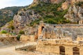 Ruins of ancient Greek-Roman theatre and rock-cut tombs of Lycian necropolis of the ancient city of Myra in Demre Royalty Free Stock Photo