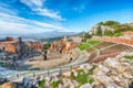 Ruins of ancient Greek theater in Taormina and Etna volcano in the backgroun Royalty Free Stock Photo
