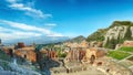 Ruins of ancient Greek theater in Taormina and Etna volcano in the background Royalty Free Stock Photo