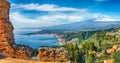 Ruins of ancient Greek theater in Taormina and Etna volcano in the background Royalty Free Stock Photo