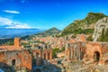 Ruins of ancient Greek theater in Taormina and Etna volcano in the background Royalty Free Stock Photo