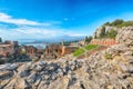 Ruins of ancient Greek theater in Taormina and Etna volcano in the background Royalty Free Stock Photo