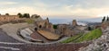 Ruins of ancient Greek theater in Taormina and Etna volcano in the background. Coast of Giardini-Naxos bay, Sicily, Italy, Europe Royalty Free Stock Photo