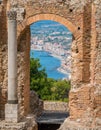 Ruins of the Ancient Greek Theater in Taormina with the sicilian coastline. Province of Messina, Sicily, southern Italy. Royalty Free Stock Photo