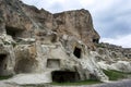 The ruins of ancient homes carved into a cliff face near Urgup in the Cappadocia region of Turkey.