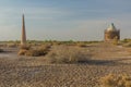 Ruins of ancient Konye-Urgench, Turkmenistan. Kutlug Timur Minaret and Sultan Tekesh Mausoleum visibl Royalty Free Stock Photo