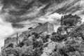 The ruins of the ancient medieval castle Monolithos against a dramatic sky, Rhodes island, Greece