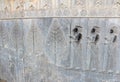 The ruins of ancient Persian capital Persepolis. Bas-relief with trees and warriorsen Royalty Free Stock Photo