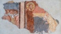 Ruins of ancient religious fresco decorating wall in Italy