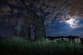 Ancient Roman aqueduct in a night scene, with the full moon