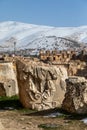 Ruins of an ancient Roman city in Lebanon in winter. Against the backdrop of the snow-capped Lebanese mountains Royalty Free Stock Photo