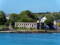 The ruins of an ancient stone grain store on the shore of Clonakilty Bay on a sunny spring day