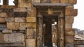 Ruins of the ancient temple complex Qutub Minar. Dilapidated brick walls.