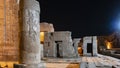 Ruins of an ancient temple in Kom Ombo against the dark night sky.