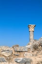 Ruins of ancient temple - top of the column against blue sky Royalty Free Stock Photo