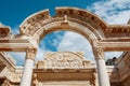 Ruins of the ancient urban architecture of the city of Ephesus, against the blue sky Temple of Hadrian