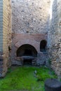 ruins of ancient vaulted ovens in pompeii archeological park