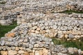 Ruins of ancient walls on the site of a destroyed ancient city Royalty Free Stock Photo