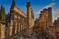 Ruins of Appollo temple with fortress at back in ancient Corinth, Peloponnese, Greece Royalty Free Stock Photo