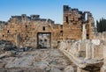 Ruins of Appollo temple with fortress at back in ancient Corinth, Peloponnese, Greece Royalty Free Stock Photo