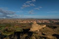 Ruins of the Arab castle in Maria de Huerva near Zaragoza early in the morning with the town and windmills of La Muela in the