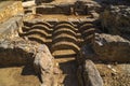 Ruins of the archaeological remains of the ancient thermal baths of a Roman running water and sewage system located in the