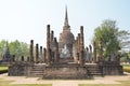Ruins of assembly hall of Wat Sa Si temple, with its large seated Buddha & bell-shaped Lanka-styled stupa chedi, Sukhothai