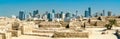 Ruins of Bahrain Fort with skyline of Manama. A UNESCO World Heritage Site