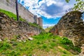 Ruins of Boskovice castle - view of surrounding walls and tower. Summer day, blue sky. Tourism in the Czech Republic - ancient